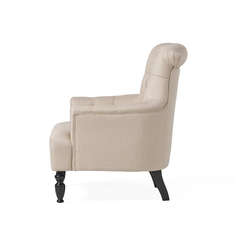Fauteuil club capitonné à dossier roulé
