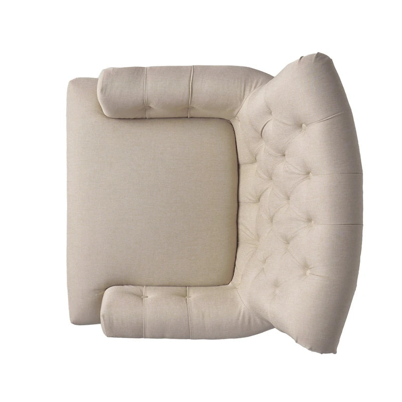 Fauteuil club capitonné à dossier roulé